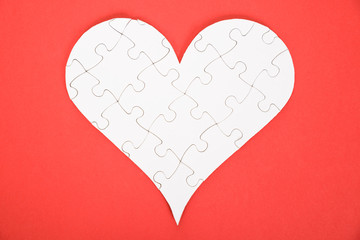 Obraz na płótnie Canvas Heart Shape Made Of Jigsaw Puzzle