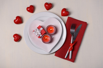 Festive table setting for Valentines Day on light background