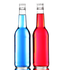 Colorful alcoholic beverages in glass bottles isolated on white