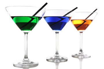 Colorful alcoholic beverages in glasses isolated on white