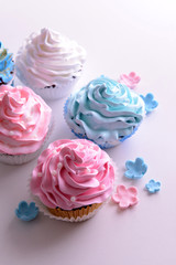 Delicious cupcakes isolated on white