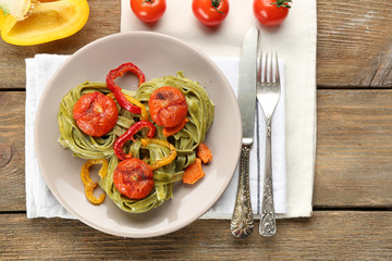 Tasty pasta with pepper, carrot and tomatoes