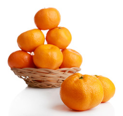 Tangerines in basket isolated on white
