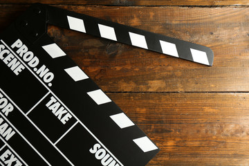Movie clapper on wooden background