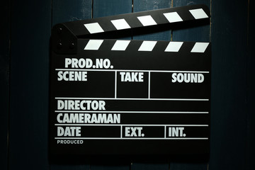 Movie clapper on wooden background