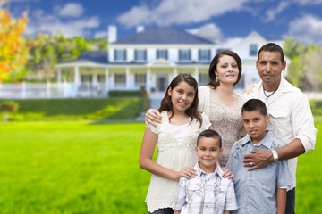 Young Hispanic Family in Front of Their New Home