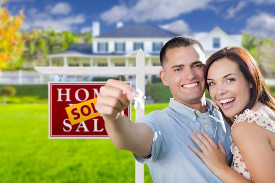 Military Couple In Front Of Home, House Keys And Sign