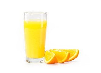 A glass of orange juice on a white background and orange slices