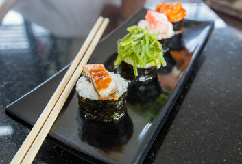 Sushi on wooden block