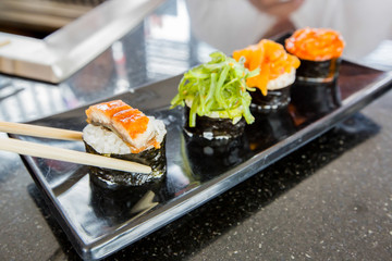 Sushi on wooden block