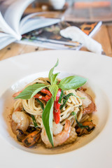 Spicy spaghetti seafood in white dish