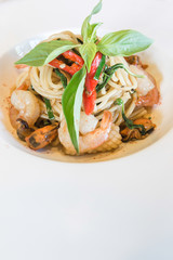 Spicy spaghetti seafood in white dish
