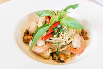 Spicy spaghetti seafood in white dish
