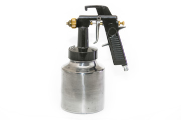 Black and metalic spray gun on white background