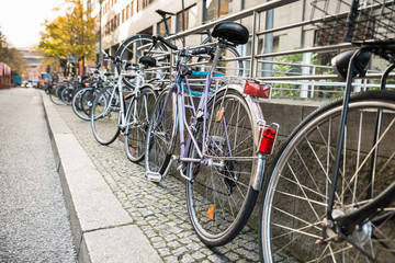 Bicycles Parked Against A Railing