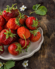Fresh strawberries on a wooden background