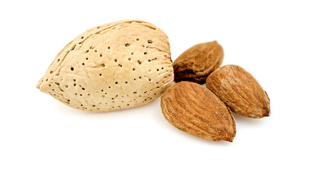 Almonds and shells isolated against white