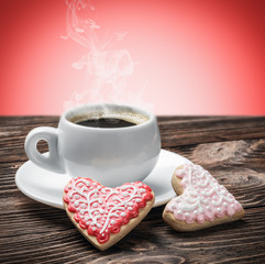 hot cup of coffee and homemade cookies on the table