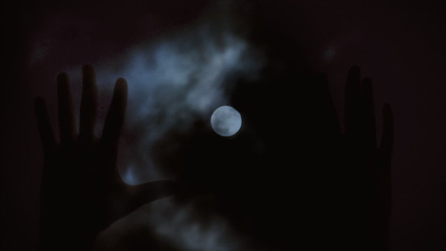 Full moon hands silhouette