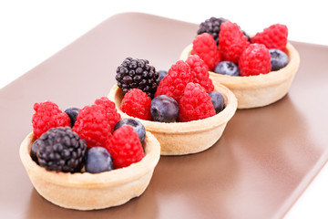 Fresh ripe berries in tartlets