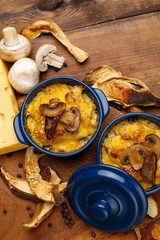 Moshroom casserole in a blue ceramic pot