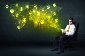 Fototapeta na wymiar Businessman in office with tablet and social network world map