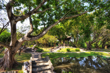 Fototapeta premium Chinese classical garden with pavilions and pond