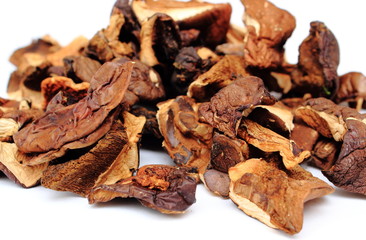 Heap of dried mushrooms on white background