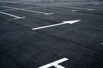 Asphalt surface of the parking with road marking lines