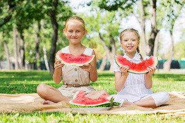 Girls eating watermelon