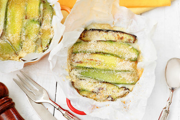 top view of zucchini parmigiana with spices and vintage silverwa