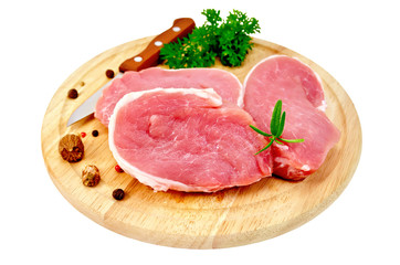 Meat pork slices with spices on round board