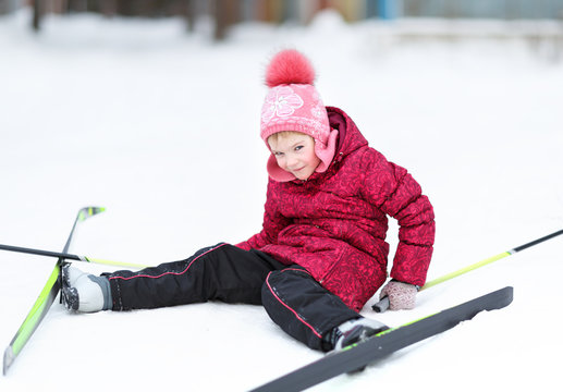 child engaged in skiing at winter