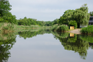 Panorama of the river with wooden bridge