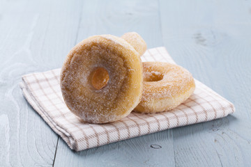 Fresh donut on blue table