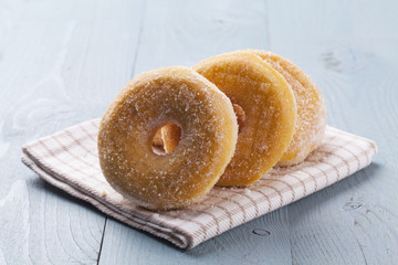 Fresh donut on blue table