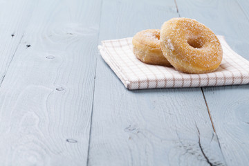 Fresh donut on blue table