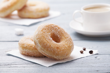 Fresh donut served with a cup of coffee