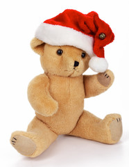 Teddy Bear with santa hat, isolated on white