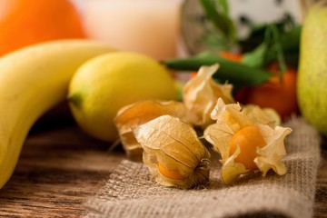 Gooseberry on jute cloth and other fruit in background2