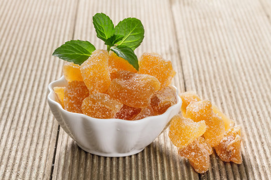 Candied Ginger On A Wooden Table