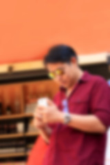 blurred man using smart phone