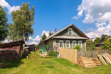 Fototapeta na wymiar Old wooden house in russian village. Novgorod region, Russia
