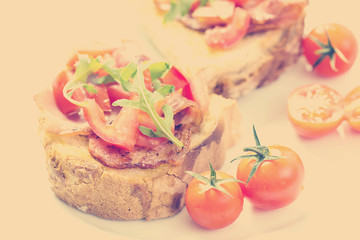 Retro Photo Of Italian Bruschetta With Cherry Tomatoes