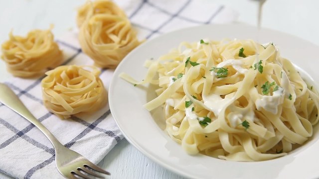 Drop sauce on pasta