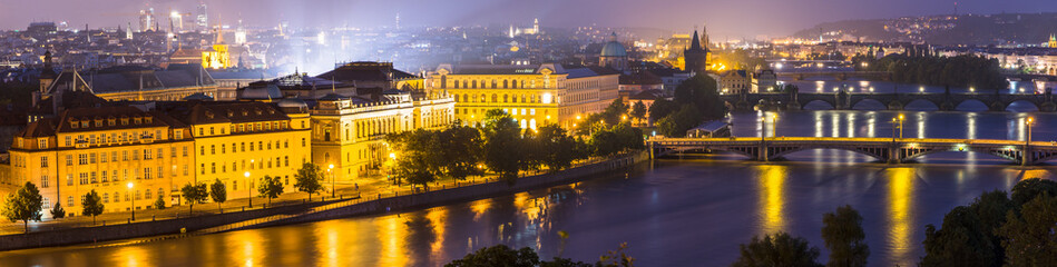 Fototapeta na wymiar Night panorama view of the Vltava River and the bridges in Pragu