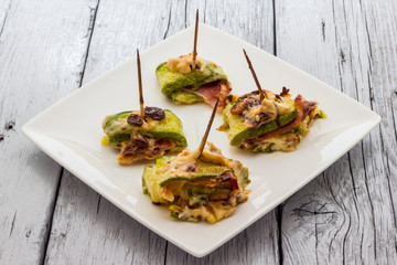 Zucchini and bacon rolls baked