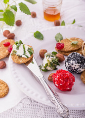 Delicious goat cheese with honey, walnut and crackers on an old