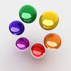 colorful glossy balls on gray