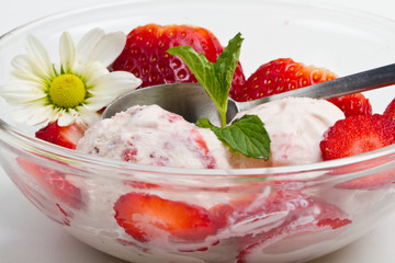 Strawberry ice cream with fruits close up